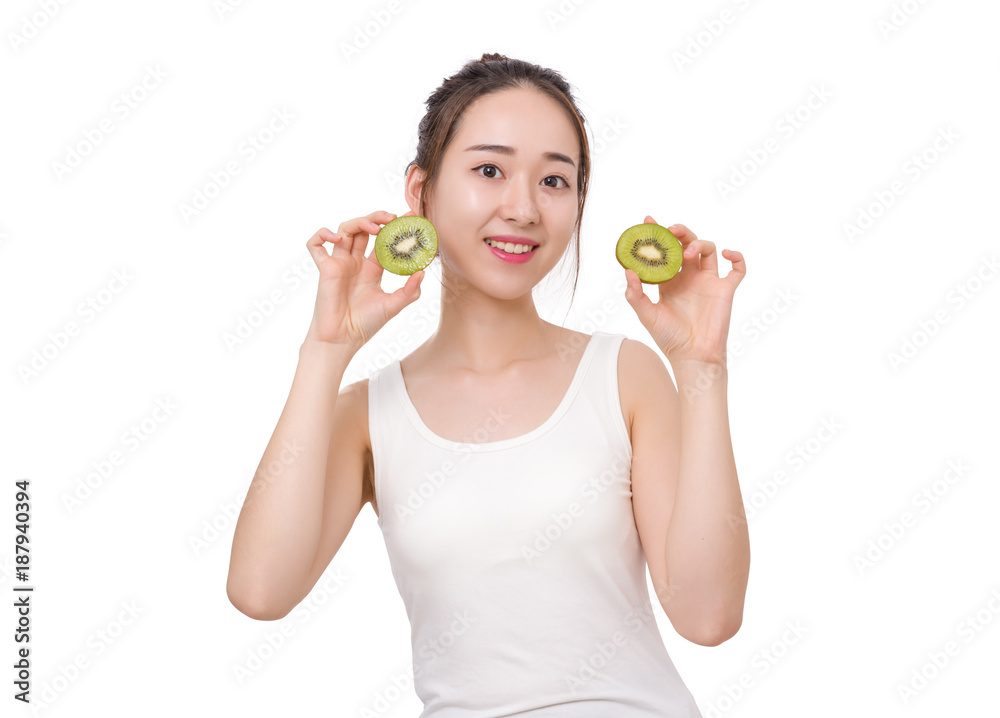 Kiwi is great for health - Healthy fruit funny woman holding kiwi fruit Kiwi is great for health - Healthy fruit funny woman holding kiwi fruit