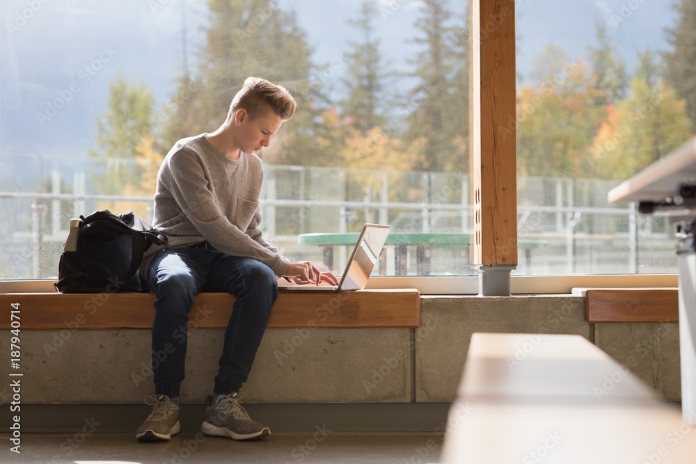 Teenage boy using laptop Teenage boy using laptop