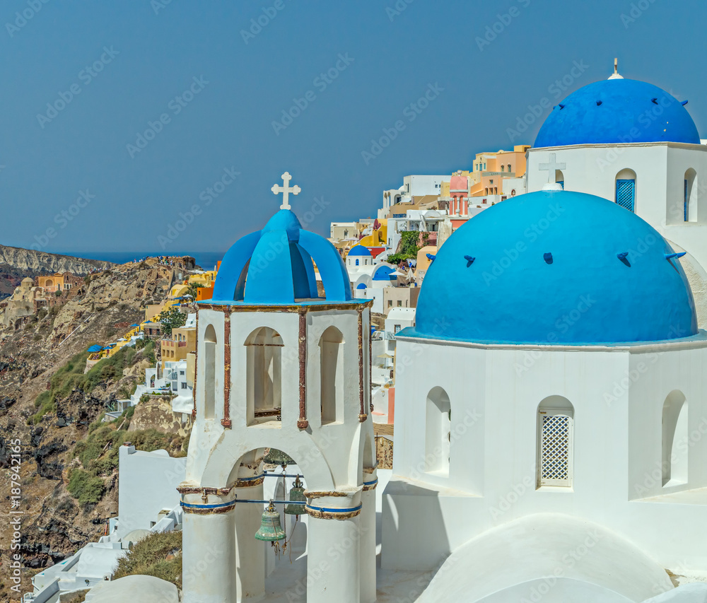 Blue domed churches in the village of Oil on Santorini i the Greek Islands