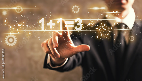 Canvastavla 1 Plus 1 Equal 3 text with businessman on dark vintage background