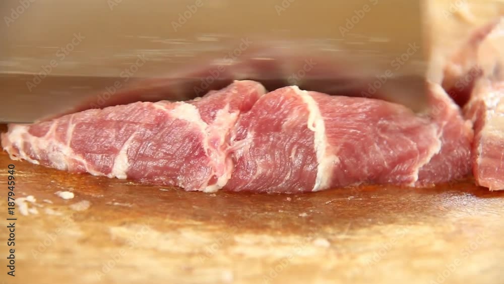 Chopping pork on board Chopping pork on board