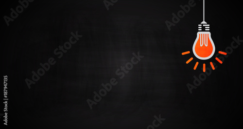 Light bulb oncept idea on chalkboard.
