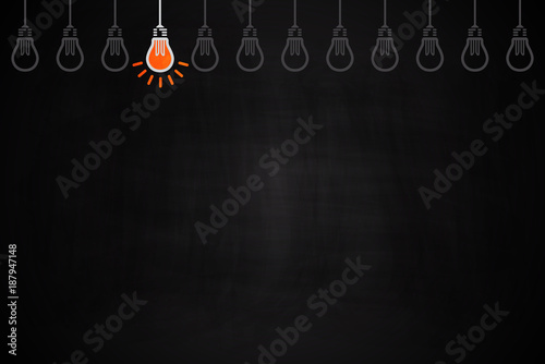 Light bulb oncept idea on chalkboard.