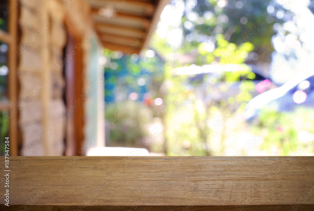 Empty wooden table in front of abstract blurred background of coffee shop . can be used for display or montage your products.Mock up for display of product. Empty wooden table in front of abstract blurred background of coffee shop . can be used for display or montage your products.Mock up for display of product.
