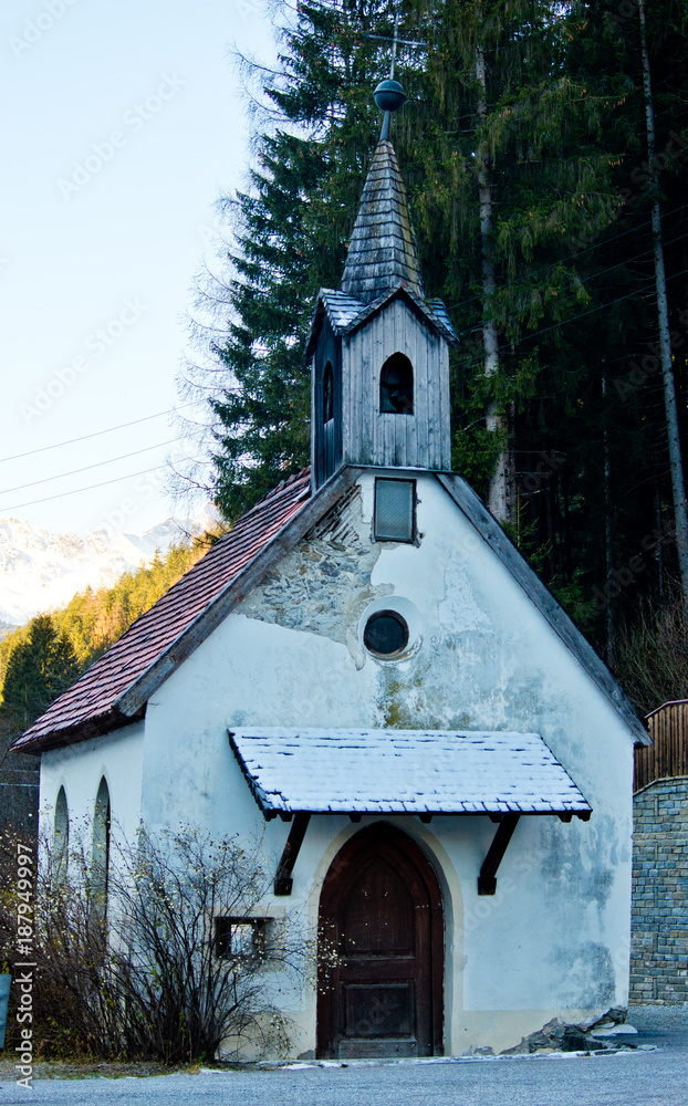 small mountain church with snow