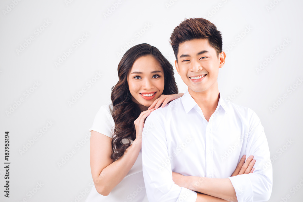 Happy together. Young in love couple smiling and standing against background Happy together. Young in love couple smiling and standing against background