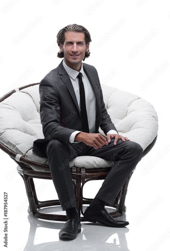 businessman sitting in a comfortable big chair businessman sitting in a comfortable big chair