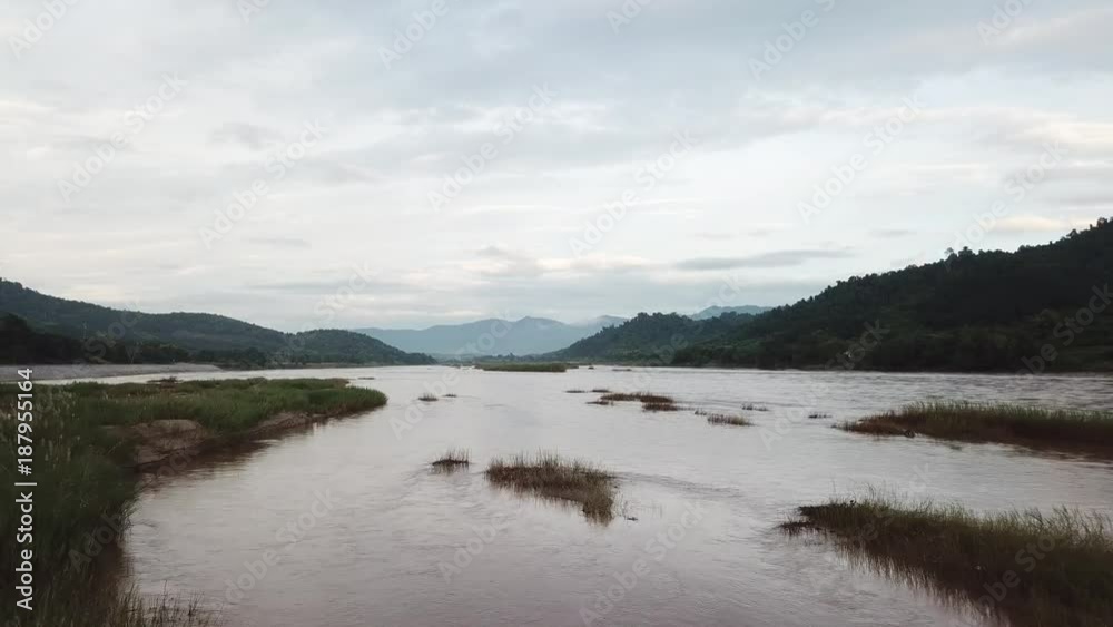 An aerial view from a drone of Mekong river, rain forest and mountains in Thailand and Laos
An aerial view from a drone of Mekong river, rain forest and mountains in Thailand and Laos