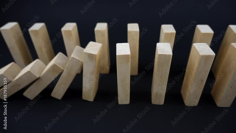 VIDEO two lines of dominoes falling in sequences on dark background in slow motion
VIDEO two lines of dominoes falling in sequences on dark background in slow motion