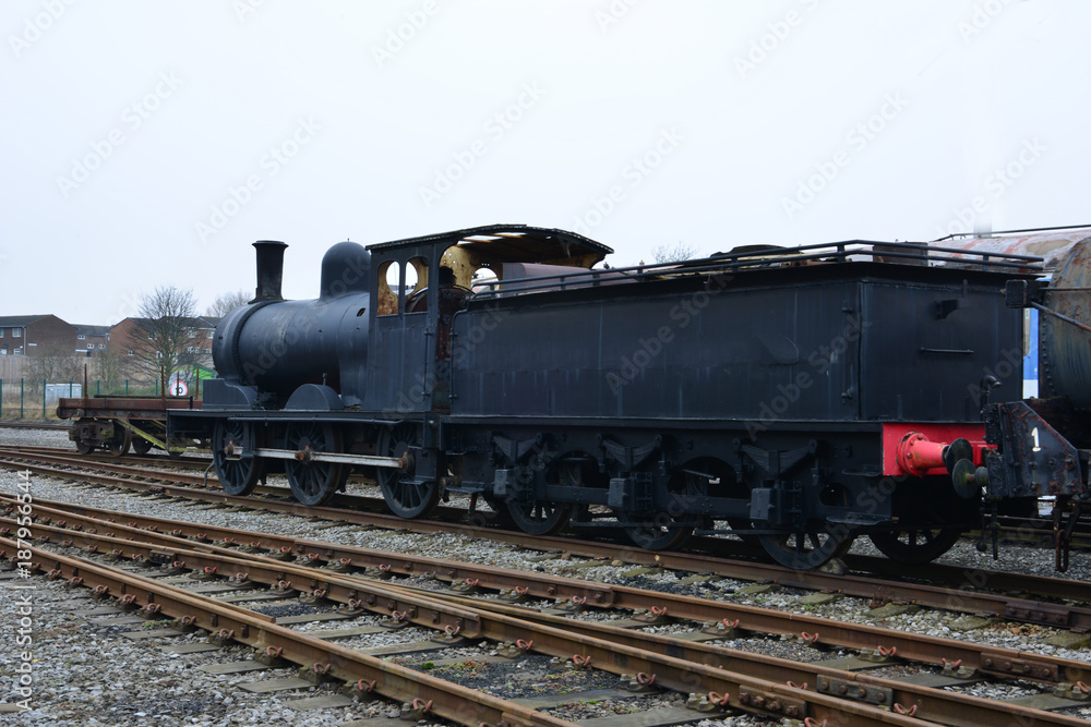 An old steam locomotive left in a railway siding in the UK.