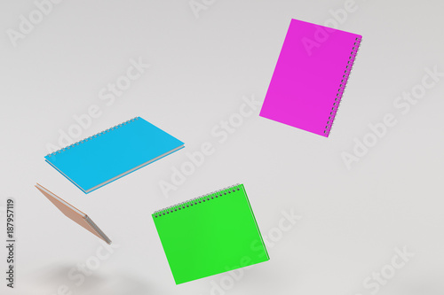 Four notebooks with spiral bound on white background