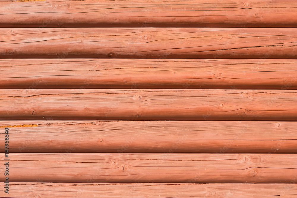 wooden wall from horizontally arranged logs, background texture wooden wall from horizontally arranged logs, background texture