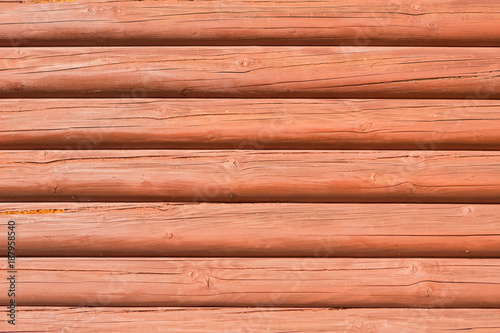 wooden wall from horizontally arranged logs, background texture