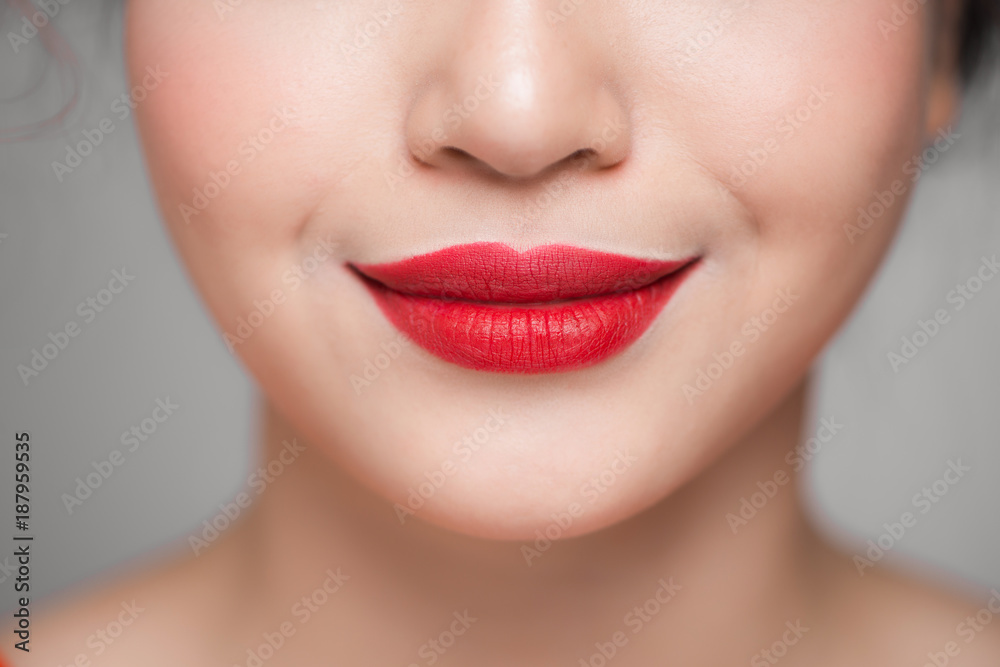 Close-up of beautiful perfect red lips. Selective focus. Close-up of beautiful perfect red lips. Selective focus.