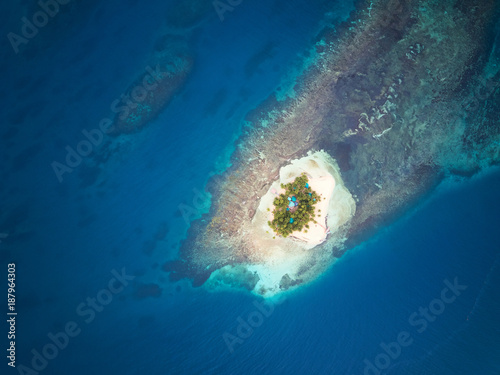 Private island on blue caribbean sea