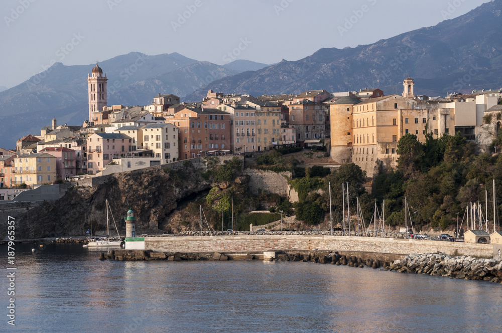 Corsica, 03/09/2017: lo skyline di Bastia, la città alla base del Capo Corso, vista dal porto principale dell'isola da cui partono e arrivano traghetti e crociere