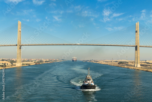 Canvastavla Ship's convoy passing through Suez Canal, in the background - the Suez Canal Bri