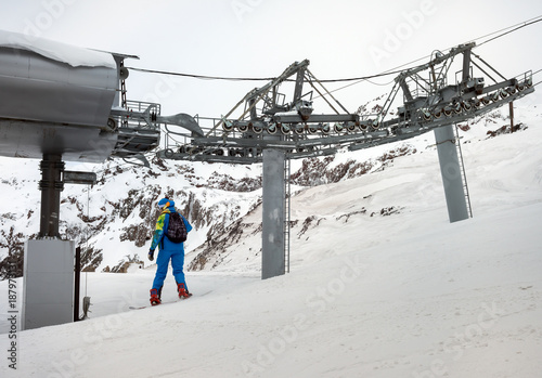 Woman snowboarder in mountains