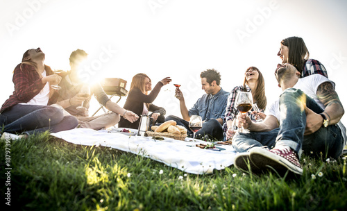 Photography Group of friends having fun while eating and drinking at a pic-nic - Happy peopl