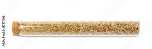 Herbal spices in a glass vial isolated