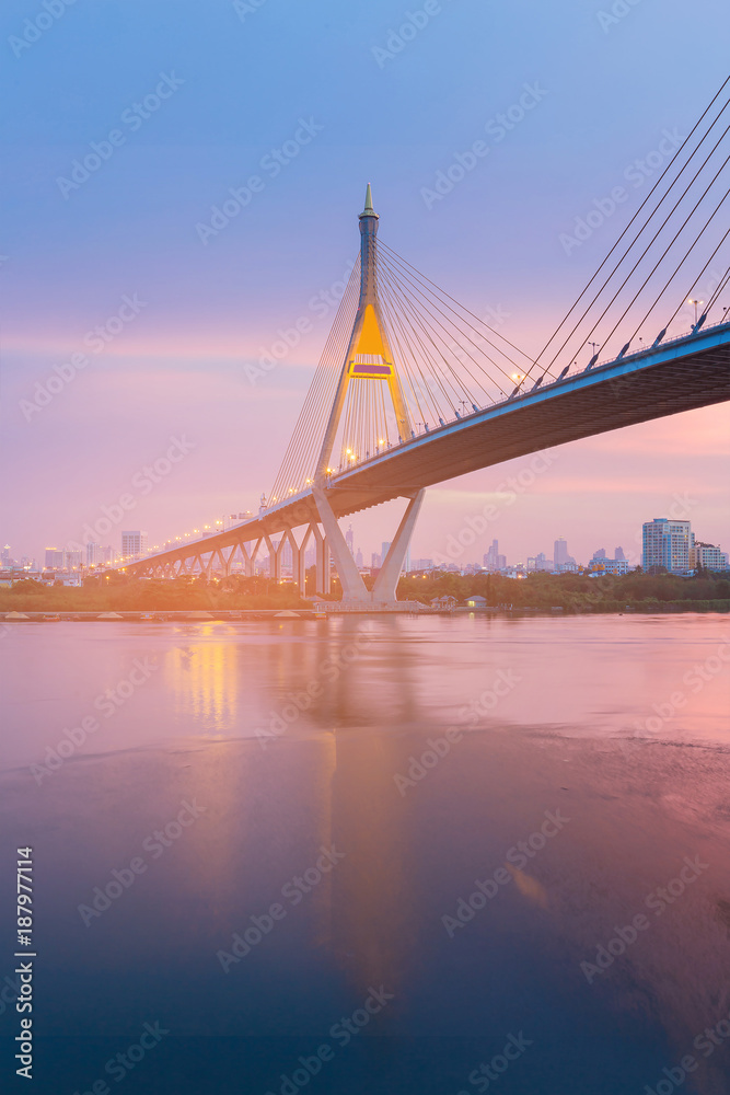 Night suspension bridge with after sunset skyline