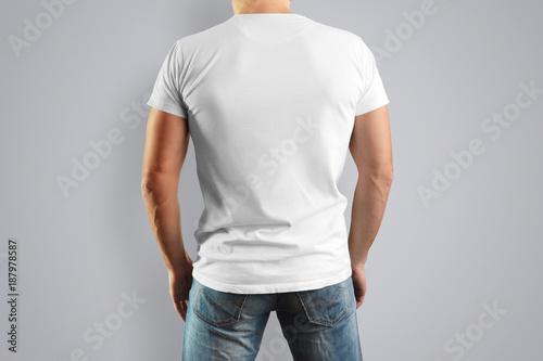 Mockup white T-shirt on a young mildew view from the back