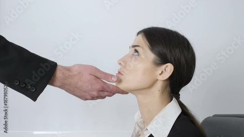 The man's hand touches the chin of a young beautiful girl. Harassment 60 fps