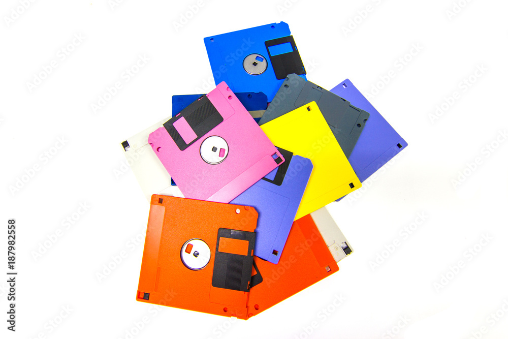 A floppy disk also called a floppy, diskette, or just disk was a ubiquitous form of data storage and exchange from the mid-1970s into the mid-2000s. isolated on white background A floppy disk also called a floppy, diskette, or just disk was a ubiquitous form of data storage and exchange from the mid-1970s into the mid-2000s. isolated on white background