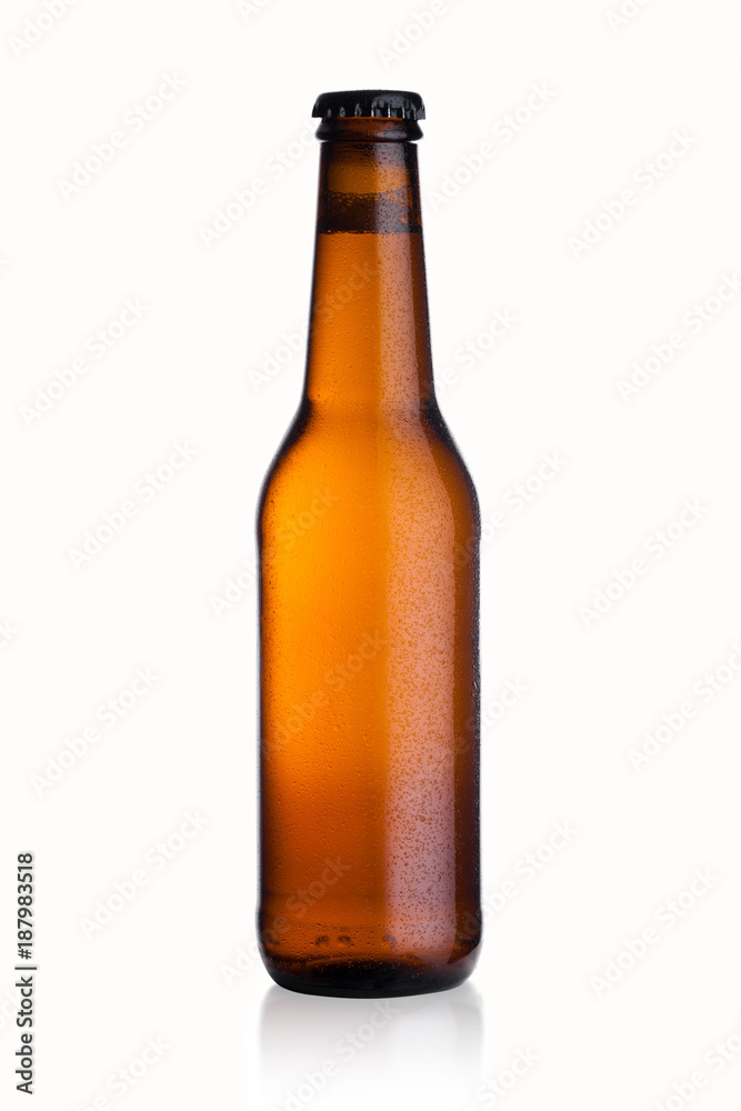 Brown glass beer bottle with black cap with dew Brown glass beer bottle with black cap with dew
