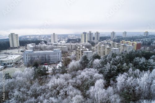 Aerial view over old soviet time architecture in Karoliniskes district, Vilnius, Lithuania. During frosty winter daytime. photo