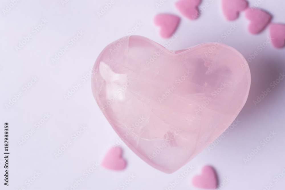 Pink Crystal Quartz Heart Sugar Candy Sprinkles on White Background. Romantic Valentines Mother's Day Charity Concept. Greeting Card Website Banner Poster Template. Copy Space
