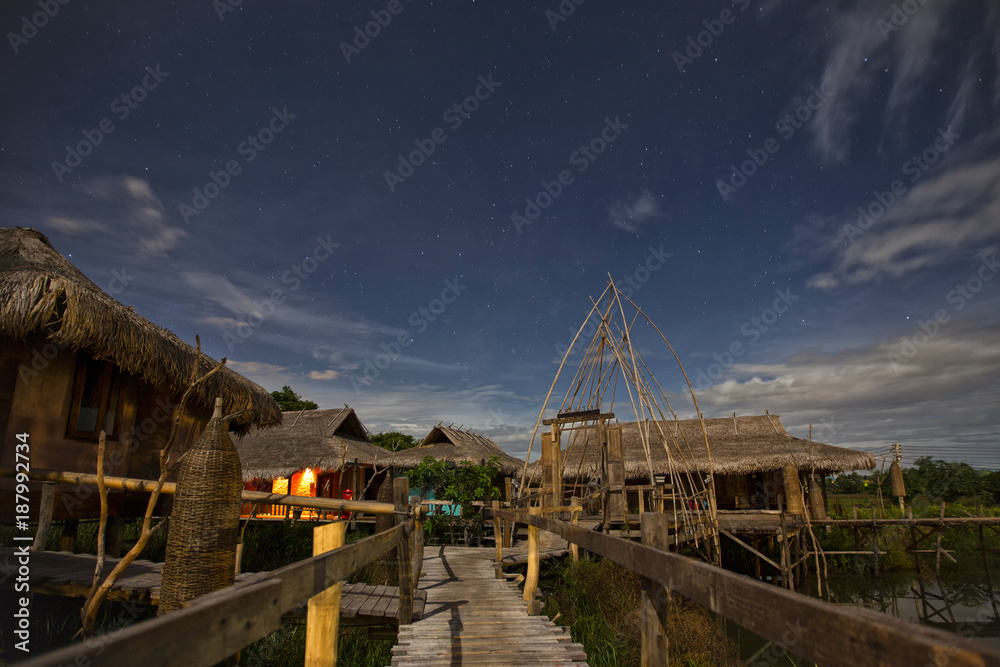 Bamboo village with starry night sky Bamboo village with starry night sky