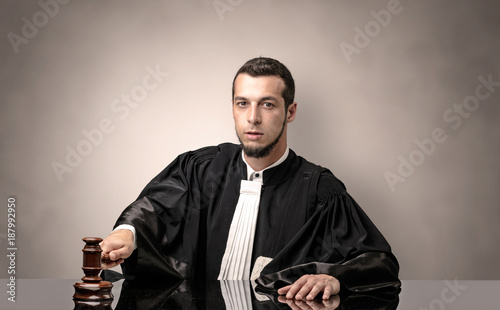 Oldscool young judge in gown photo