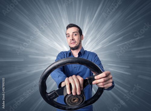 Man holding steering wheel