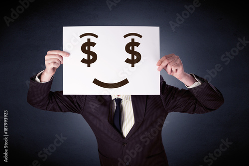 Businessman holding paper with greedy emotion