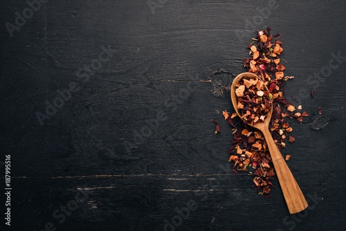 Tea made from dried berries and fruits. On a wooden background. Top view. Copy space.