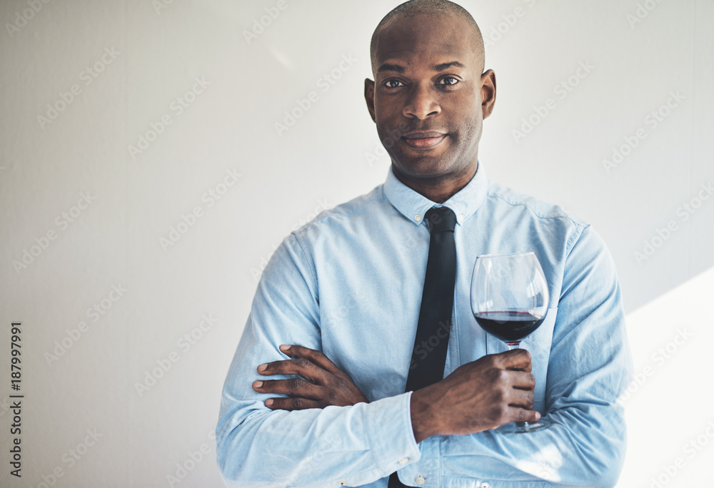 Confident mature man drinking a glass of red wine Confident mature man drinking a glass of red wine