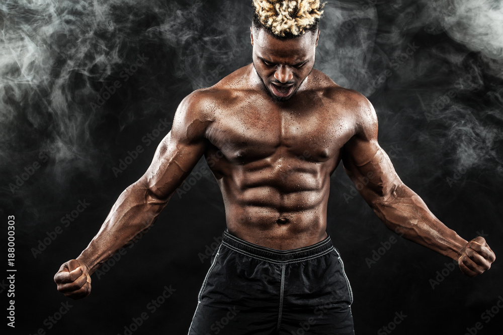 Sports wallpaper on dark background. Power athletic guy bodybuilder. Stock  Photo | Adobe Stock