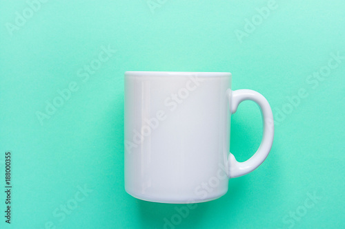 Blank White Mug Mockup on Light Turquoise Background. Template Space for Creative Artwork Lettering Text Product Promotion Branding. Elegant Feminine Style Flat Lay