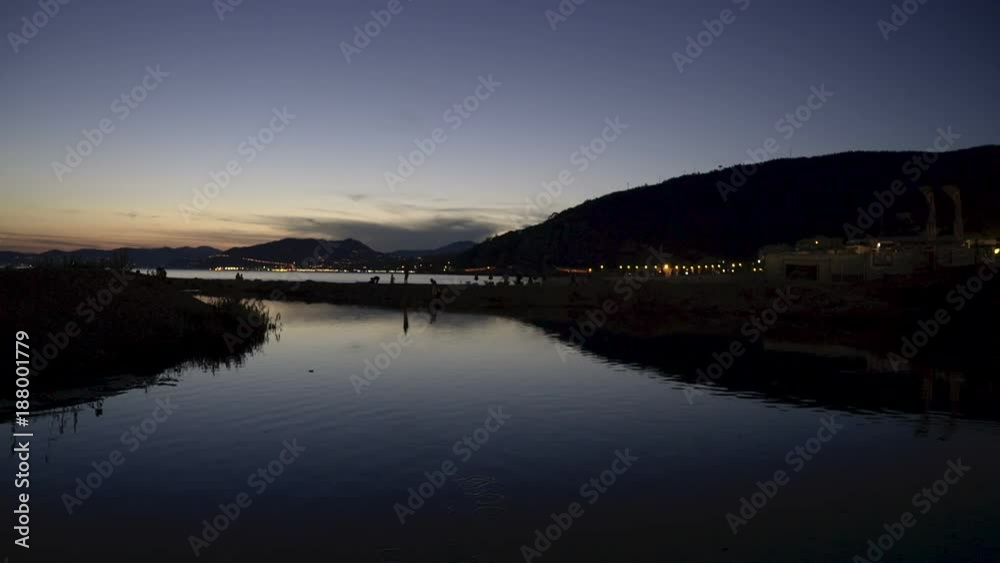 Seaside town lights filmed at night.