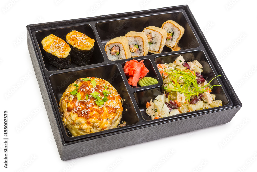 Sushi and roll set in bento box with seafood isolated on white background. Japanese cuisine. Sushi and roll set in bento box with seafood isolated on white background. Japanese cuisine.
