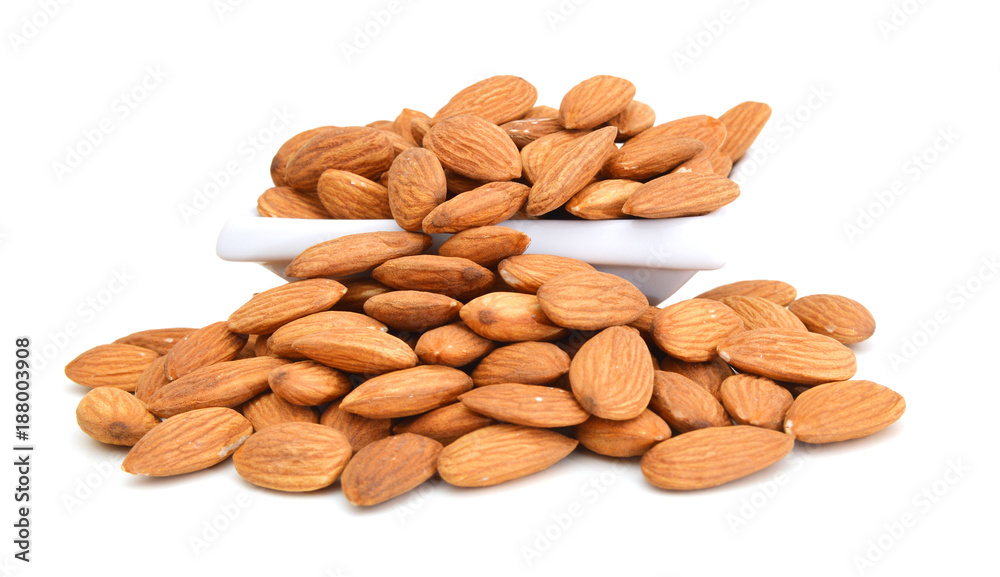 almonds in white bowl on white almonds in white bowl on white