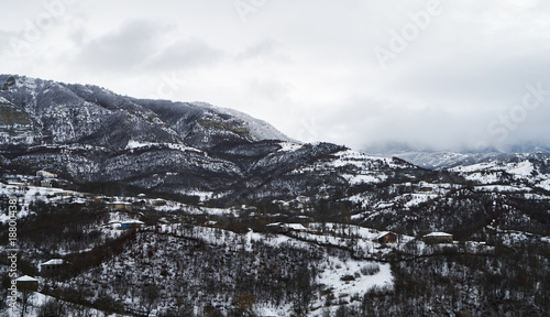 Winter mountain village landscape with snow and little houses