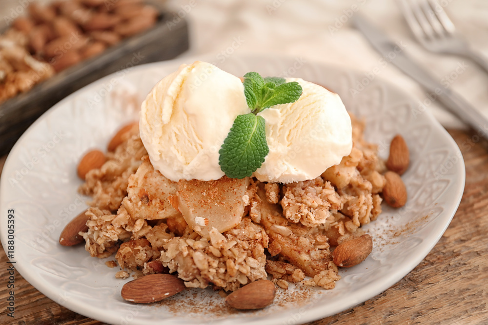 Plate with apple crisp and ice cream on table, closeup Plate with apple crisp and ice cream on table, closeup