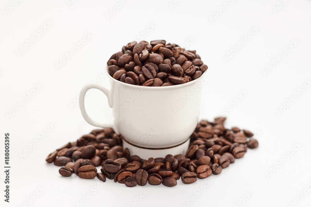 Coffee beans in coffee cup on white background Coffee beans in coffee cup on white background