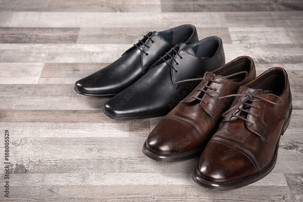 Elegant leather men's shoes on floor