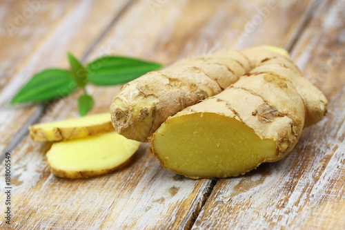 Fresh ginger on rustic wooden surface
