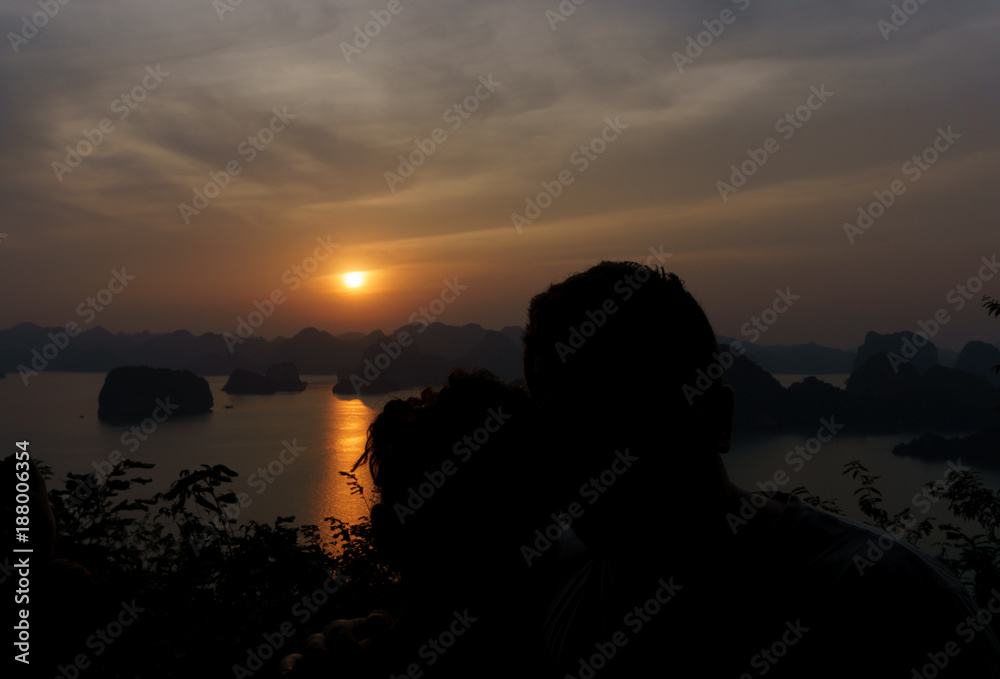 romantic couple in halong bay Vietnam during sunset