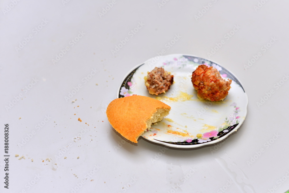 Food waste. Top view piece of food remains on plate. Food waste. Top view piece of food remains on plate.