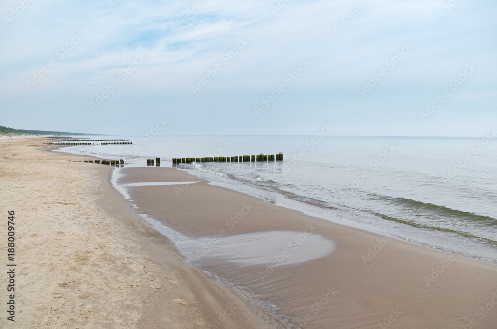 Baltic Sea - blue sky, beach, wave sea and waterbreak. 